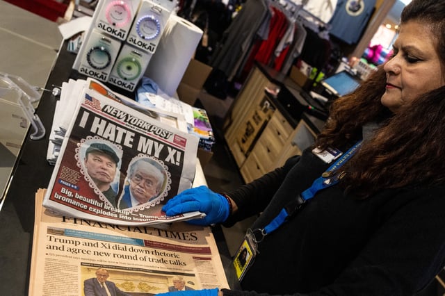 A newspaper front page featuring U.S. President Donald Trump and Elon Musk is displayed at a shop at Ronald Reagan Washington National Airport in Arlington, Virginia, U.S., June 6, 2025. REUTERS/Carlos Barria