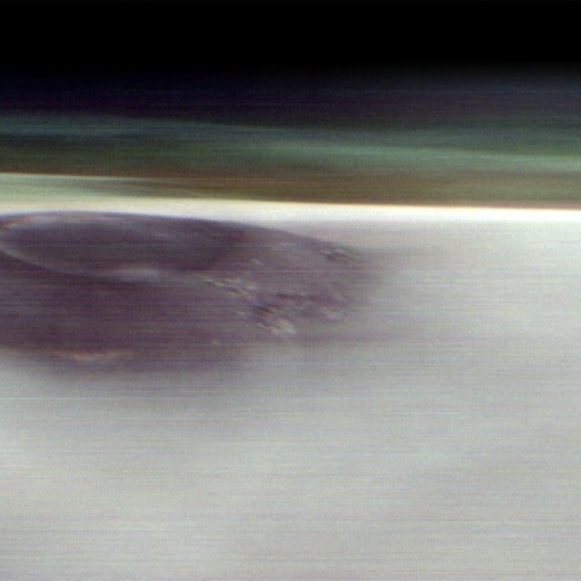 NASA's Mars Odyssey orbiter captured the first horizon view of Arsia Mons, an enormous volcano on the Red Planet.
