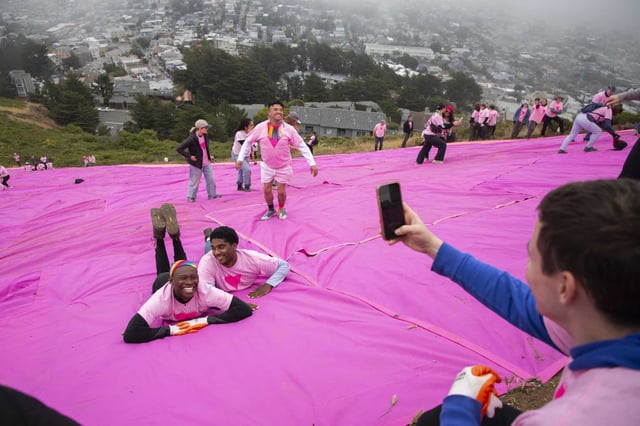 Ky&#39;ree Fincher, left, and Bryson Howard take a photo together after installing the Pink Triangle on Twin Peaks. 