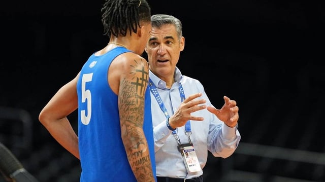 Apr 4, 2025; San Antonio, TX, USA; Florida Gators guard Will Richard (5) and TV personality Jay Wright during a practice session for the Final Four of the 2025 NCAA tournament at Alamodome. Mandatory Credit: Bob Donnan-Imagn Images