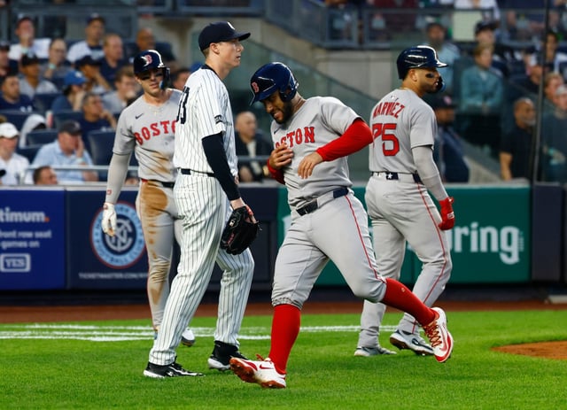Boston Red Sox first baseman Romy Gonzalez (23) reacts after scoring against New York Yankees pitcher Ryan Yarbrough with Carlos Narváez (75) and Abraham Toro during the third inning of a baseball game, Saturday, June 7, 2025, in New York. (AP Photo/Noah K. Murray)