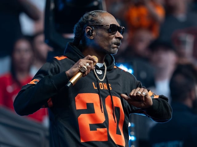 Snoop Dogg performs before the Edmonton Elks and the B.C. Lions play a CFL football game in Vancouver, on Saturday, June 7, 2025.