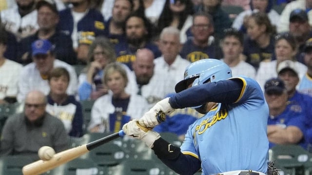 Jun 7, 2025; Milwaukee, Wisconsin, USA; Milwaukee Brewers third base Caleb Durbin (21) hits to San Diego Padres third base Manny Machado (13) for an out in the fifth inning at American Family Field. Mandatory Credit: Michael McLoone-Imagn Images