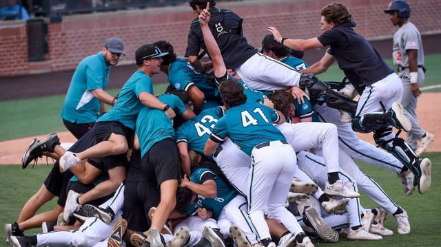 Coastal Carolina players dogpile after eliminating Auburn in the NCAA Baseball Super Regonal at Plainsman Park in Auburn, Ala., on Friday June 6, 2025.