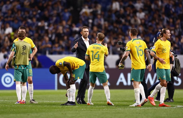 Soccer Football - World Cup - Asian Qualifiers - Third Round - Group C - Japan v Australia - Saitama Stadium 2002, Saitama, Japan - October 15, 2024  Australia coach Tony Popovic shakes hands with Riley McGree after the match REUTERS/Issei Kato/File Photo