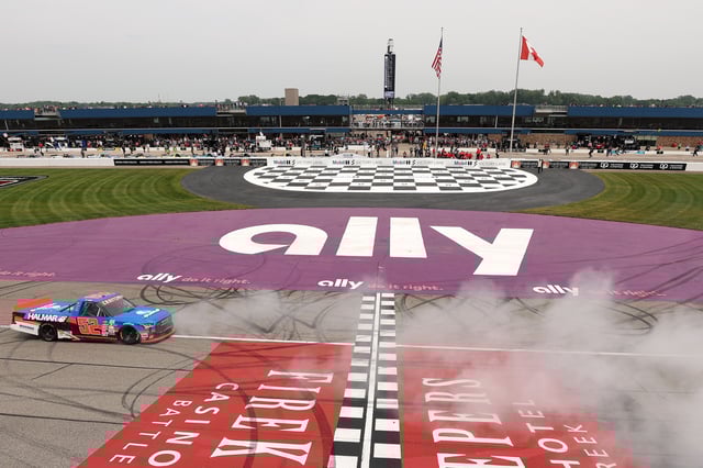 Stewart Friesen, driver of the #52 Halmar International Toyota, celebrates with a burnout after winning the NASCAR Craftsman Truck Series DQS Solutions &amp; Staffing 250 Powered by Precision Vehicle Logistics at Michigan International Speedway on June 07, 2025 in Brooklyn, Michigan.