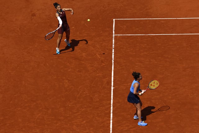 Tennis - French Open - Roland Garros, Paris, France - June 8, 2025   Italy's Jasmine Paolini and Sara Errani in action during their women's doubles final match against Serbia's Aleksandra Krunic and Kazakhstan's Anna Danilina REUTERS/Stephanie Lecocq