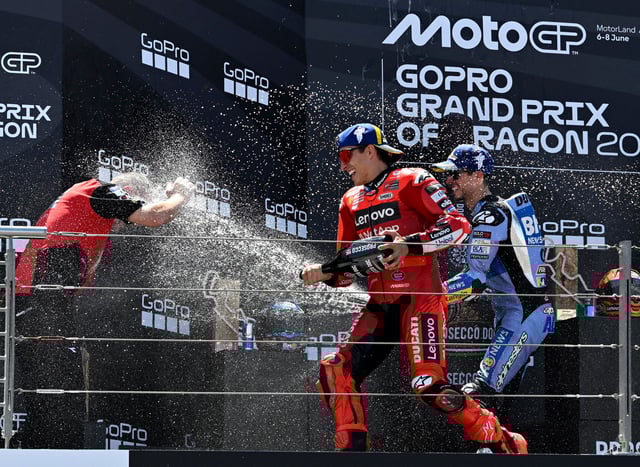 MotoGP - Aragon Grand Prix - Ciudad del Motor de Aragon, Alcaniz, Spain - June 8, 2025 Ducati Lenovo Team's Marc Marquez celebrates on the podium after winning the MotoGP race with second placed BK8 Gresini Racing MotoGP's Alex Marquez REUTERS/Pablo Morano