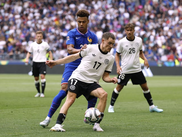 Soccer Football - Nations League - Third Place Play Off Match - Germany v France - MHPArena, Stuttgart, Germany - June 8, 2025 France's Desire Doue in action with Germany's Florian Wirtz REUTERS/Heiko Becker