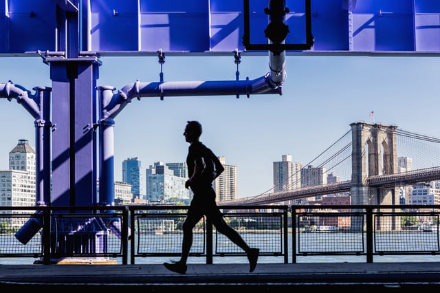 Man running along the FDR drive on the east side of the New York City borough of Manhattan.