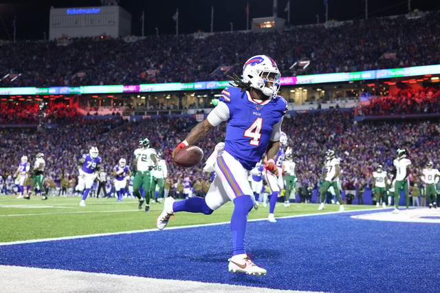 ORCHARD PARK, NEW YORK - NOVEMBER 19: James Cook #4 of the Buffalo Bills scores a touchdown in the second quarter against the New York Jets at Highmark Stadium on November 19, 2023 in Orchard Park, New York.