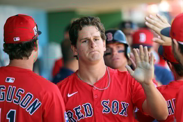 Feb 28, 2025; Clearwater, Florida, USA; Boston Red Sox outfielder Roman Anthony (48) is congratulated after he scored a run against the Philadelphia Phillies  during the third inning  at BayCare Ballpark. Mandatory Credit: Kim Klement Neitzel-Imagn Images/File Photo