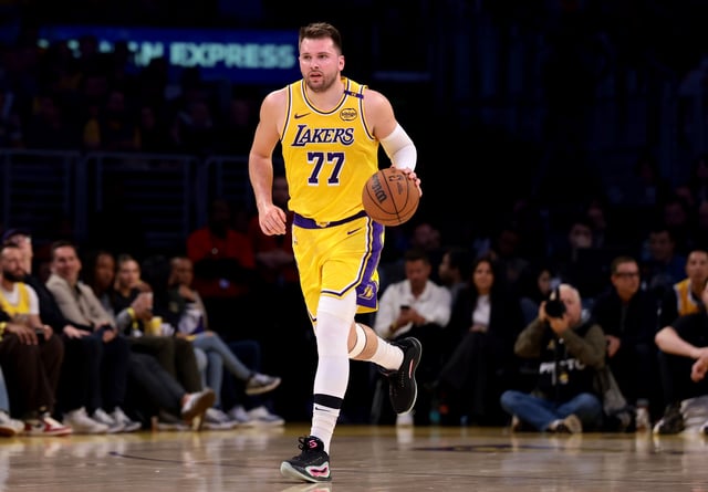Luka Doncic #77 of the Los Angeles Lakers brings the ball up court during the first quarter against the Houston Rockets at Crypto.com Arena on April 11, 2025 in Los Angeles, California.