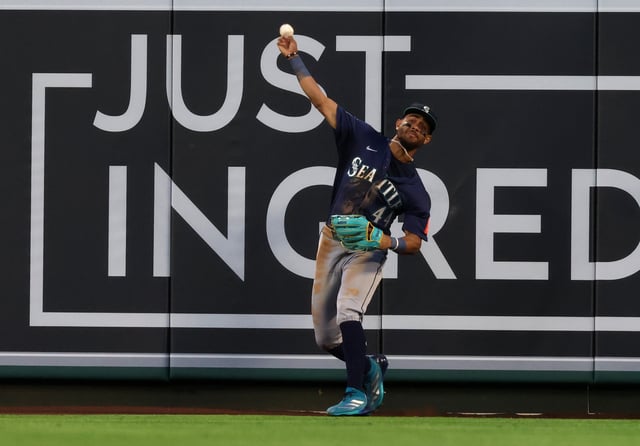 Jun 6, 2025; Anaheim, California, USA; Seattle Mariners outfielder Julio Rodriguez (44) throws to the infield during the fourth inning against the Los Angeles Angels at Angel Stadium. Mandatory Credit: Jason Parkhurst-Imagn Images