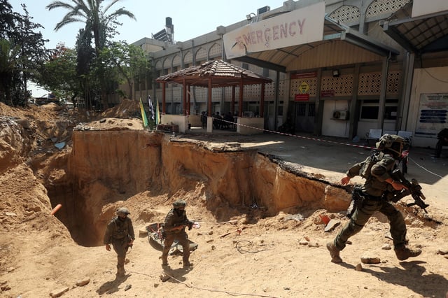 Israeli soldiers walk out from a tunnel underneath the European Hospital in Khan Younis at the Gaza Strip, amid the ongoing ground operation of the Israeli army against Palestinian Islamist group Hamas, June 8, 2025. REUTERS/Ronen Zvulun