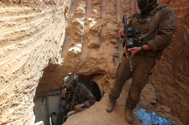 Israeli soldiers walk out from a tunnel underneath the European Hospital in Khan Younis at the Gaza Strip, amid the ongoing ground operation of the Israeli army against Palestinian Islamist group Hamas, June 8, 2025. REUTERS/Ronen Zvulun
