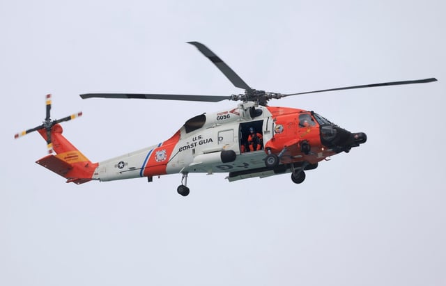 A U.S. Coast Guard helicopter patrols Del Mar in the early morning on Monday, May 5, 2025. (K.C. Alfred / The San Diego Union-Tribune)