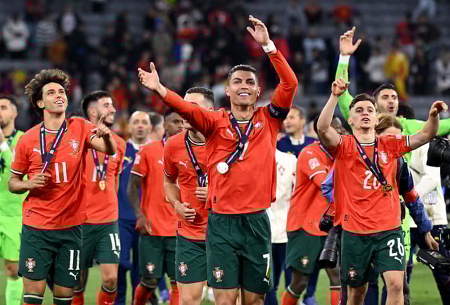 Soccer Football - Nations League - Final - Portugal v Spain - Allianz Arena, Munich, Germany - June 8, 2025 Portugal's Cristiano Ronaldo, Francisco Conceicao and Joao Felix celebrate in front of the fans after winning the UEFA Nations League REUTERS/Angelika Warmuth