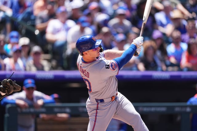 New York Mets&#39; Pete Alonso follows the flight of his two-run home run off Colorado Rockies starting pitcher Chase Dollander in the third inning of a baseball game Sunday, June 8, 2025, in Denver. (AP Photo/David Zalubowski)