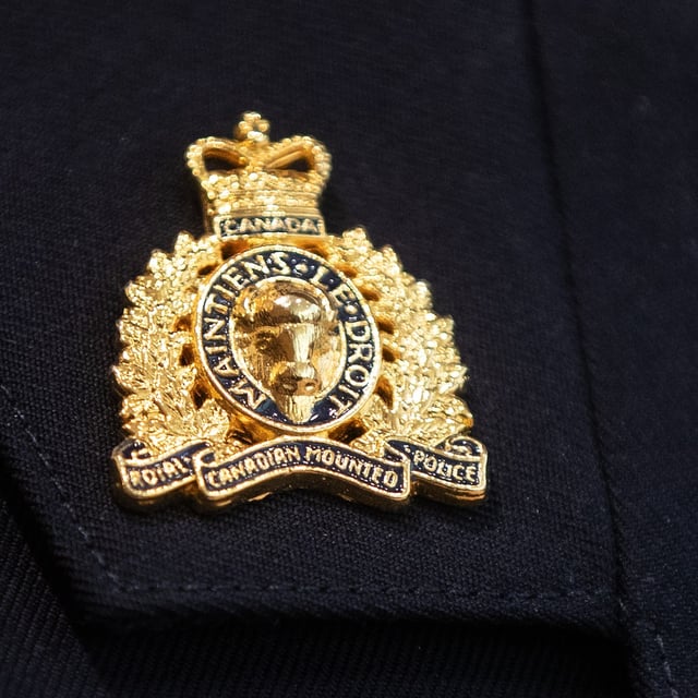 An RCMP collar tab pin is seen in Edmonton, Wednesday, Feb. 5, 2025. THE CANADIAN PRESS/Jason Franson