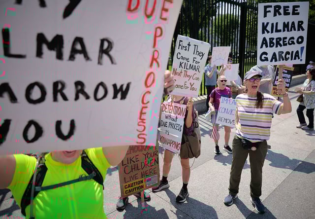 Demonstrators rally outside the White House to demand the return of Kilmar Armando Abrego Garcia to the United States and to mark the May Day holiday on May 1, 2025.