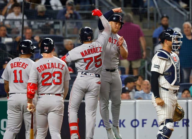 Boston Red Sox&#39;s Carlos Narváez (75)celebrates with Rob Refsnyder after hitting a home run against the New York Yankees during the sixth inning of a baseball game, Sunday, June 8, 2025, in New York. (AP Photo/Noah K. Murray)