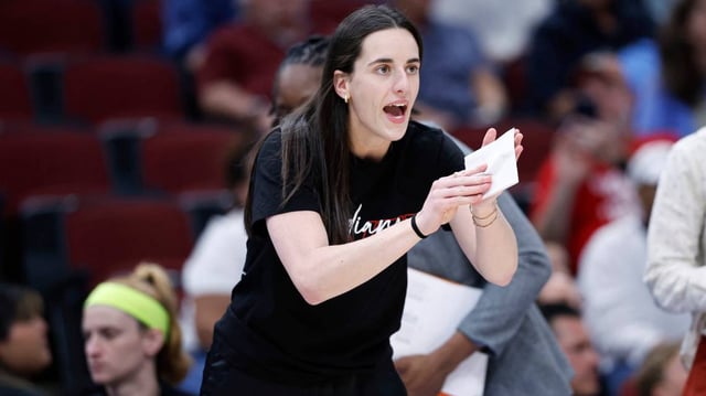 Jun 7, 2025; Chicago, Illinois, USA; Indiana Fever guard Caitlin Clark (22) applauds her teammates during the first half of a WNBA game against the Chicago Sky at United Center. Mandatory Credit: Kamil Krzaczynski-Imagn Images