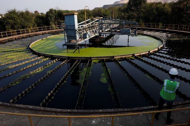 A worker stands inside a sewage treatment plant in Chandrapur, India, February 2, 2025. REUTERS/Priyanshu Singh