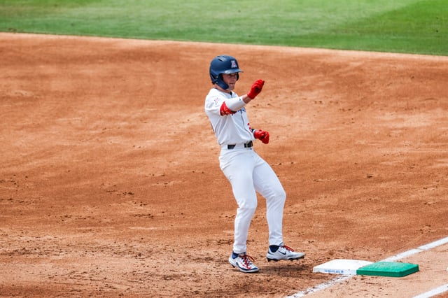 Jun 7, 2025; Chapel Hill, NC, USA;  Arizona infielder Mason White (24) celebrates getting on first base during the first inning of the Super Regionals game against North Carolina in Chapel Hill, North Carolina. Mandatory Credit: Jaylynn Nash-Imagn Images