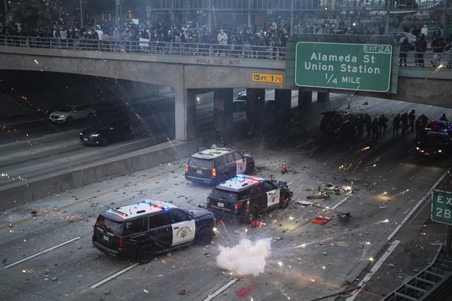 A flash bomb is deployed on the 101 highway near the Metropolitan Detention Center in Los Angeles
