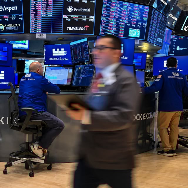 Traders work on the floor of the New York Stock Exchange (NYSE) at the opening bell on June 2, 2025, in New York City.