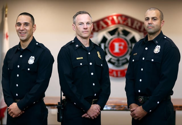 Hayward firefighter Frank Crespo, left, Deputy Chief Ryan Hamre, center, and Captain Andrew Ghali at the Hayward Firefighters Local 1909 office on Thursday, May 29, 2025, in Hayward, Calif.  A new partnership between the Hayward Fire Department and biotech firm Prenuvo, is offering firefighters access to MRIs to scan for cancer.   (Aric Crabb/Bay Area News Group)