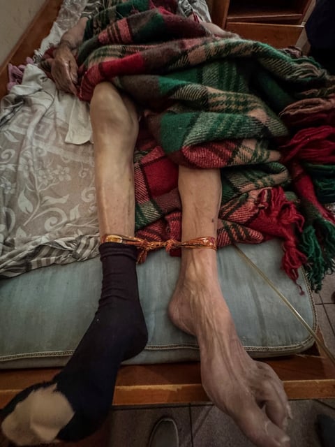 A picture shows the tied feet of an elderly person at an illegal hospice in the village of Yagoda, Bulgaria, in this image released to Reuters on June 9, 2025. Bulgarian Ministry of Justice/Handout via REUTERS ATTENTION EDITORS - THIS IMAGE HAS BEEN SUPPLIED BY A THIRD PARTY. NO RESALES. NO ARCHIVES