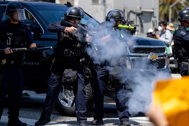 LAPD officers fire rubber bullets at protesters during an anti-ICE protest in downtown Los Angeles, California, on June 8, 2025.