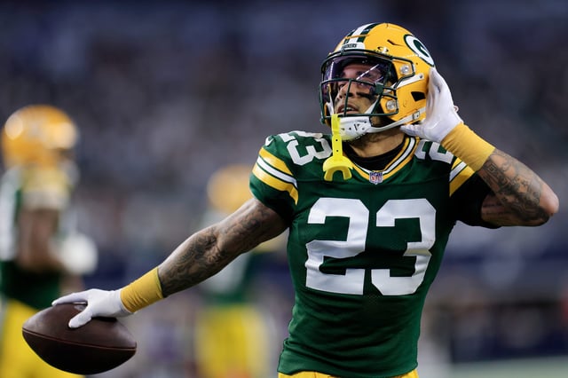 Jaire Alexander #23 of the Green Bay Packers reacts to an interception during the first quarter against the Dallas Cowboys in the NFC Wild Card Playoff game at AT&amp;T Stadium on January 14, 2024 in Arlington, Texas.