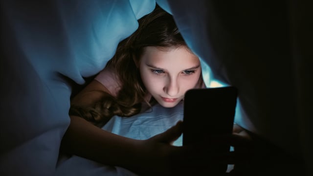 A stock image showing a child on their screen.