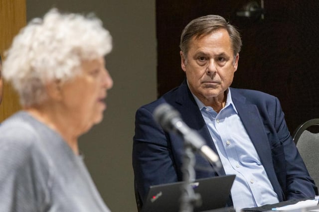Aqua Illinois President David Carter listens to concerns voiced Aug. 1, 2024, during public comment at an Illinois Commerce Commission public forum at Olivet Nazarene University in Bourbonnais. (Andrew Adams/Capitol News Illinois)