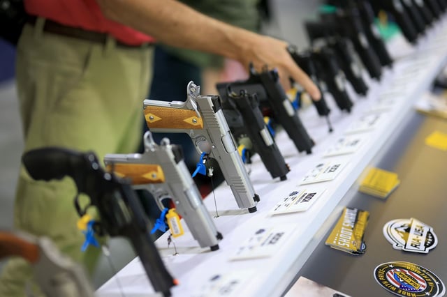 ATLANTA, GEORGIA - APRIL 26: Handguns on display at the  Rock Island Armory booth at the 2025 NRA Annual Meetings & Exhibits held in the Georgia World Congress Center on April 26, 2025 in Atlanta, Georgia. The 154th NRA Annual Meetings & Exhibits is held from April 24-27, 2025, and features over 14 acres of the latest guns and gear, seminars, workshops, and special events. (Photo by Joe Raedle/Getty Images)