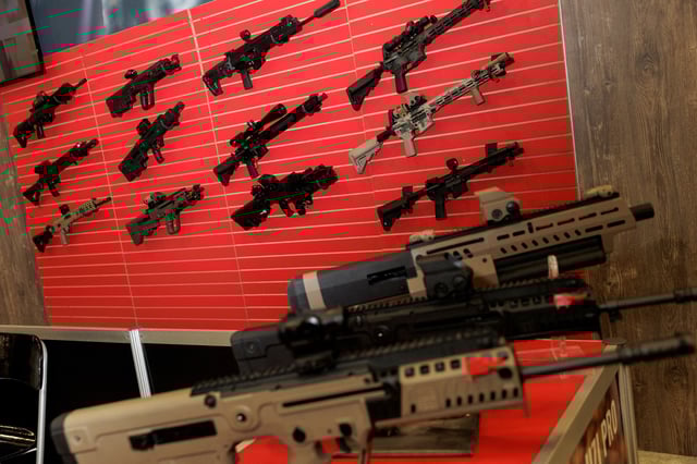Guns are displayed at an exhibition booth, during the annual National Rifle Association (NRA) meeting in Dallas, Texas, U.S., May 19, 2024. REUTERS/Shelby Tauber/File Photo