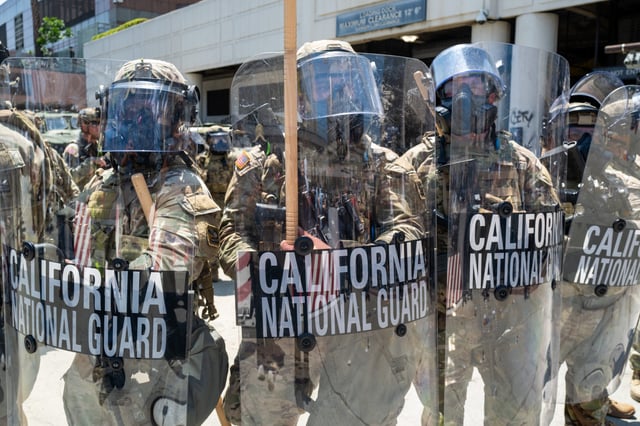 LOS ANGELES, CALIFORNIA - JUNE 08: Demonstrators protest outside a downtown jail in Los Angeles following two days of clashes with police during a series of immigration raids on June 08, 2025 in Los Angeles, California. Tensions in the city remain high after the Trump administration called in the National Guard against the wishes of city leaders. (Photo by Spencer Platt/Getty Images)