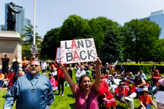 Protesters and community members chant and wave signs, as they listen to speakers during a demonstration opposing Bill 5, outside the Ontario Legislature at QueenÕs Park in Toronto, Monday, June 2, 2025. 