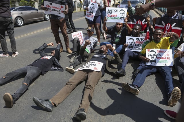 Demonstrators block in road as they react to the death of Kenyan blogger Albert Ojwang, who died while in police custody, in Nairobi, Monday, June 9, 2025. (AP Photo/Andrew Kasuku)