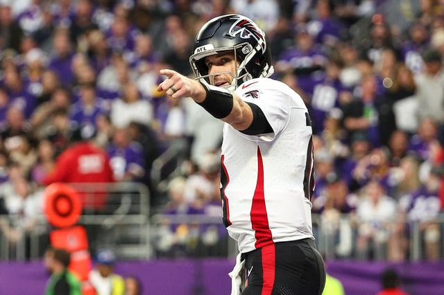 Dec 8, 2024; Minneapolis, Minnesota, USA; Atlanta Falcons quarterback Kirk Cousins (18) celebrates running back Bijan Robinson's (7) touchdown against the Minnesota Vikings during the third quarter at U.S. Bank Stadium. Mandatory Credit: Matt Krohn-Imagn Images/File Photo