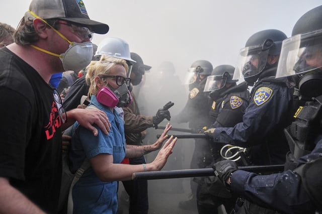 Protesters confront police on the 101 Freeway near the Metropolitan Detention Center of downtown Los Angeles on Sunday, June 8.