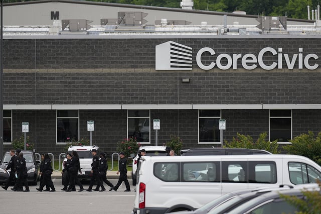 Prison personnel march into the Trousdale Turner Correctional Center, Monday, June 9, 2025, in Hartsville, Tenn. (AP Photo/George Walker IV)