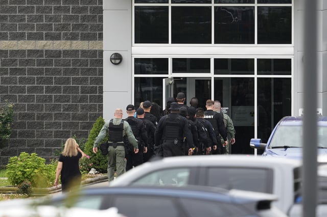Prison personnel enter the The Trousdale Turner Correctional Center, Monday, June 9, 2025, in Hartsville, Tenn. (AP Photo/George Walker IV)