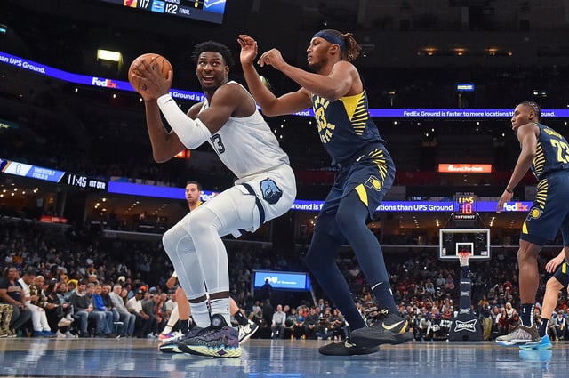 Jaren Jackson Jr. #13 of the Memphis Grizzlies handles the ball against Myles Turner #33 of the Indiana Pacers during the game at FedExForum on January 29, 2023 in Memphis, Tennessee.
