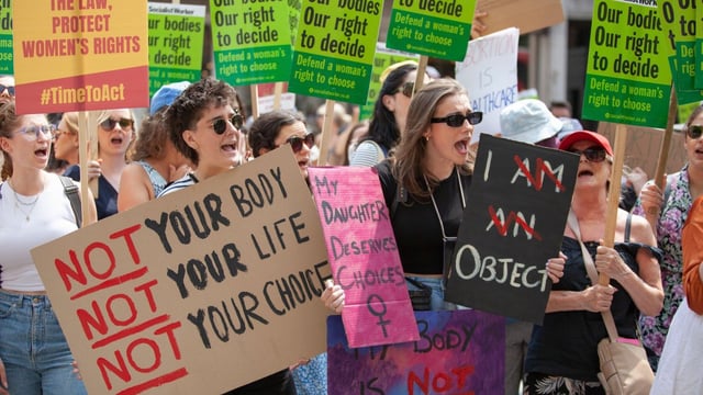 Protesters call for an overhaul of abortion rights and march on Whitehall in June 2023