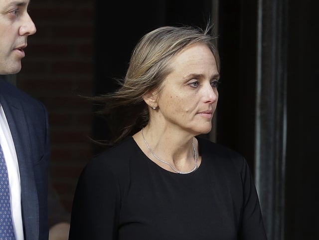 FILE - District Court Judge Shelley M. Richmond Joseph departs federal court, April 25, 2019, in Boston. (AP Photo/Steven Senne, file)
