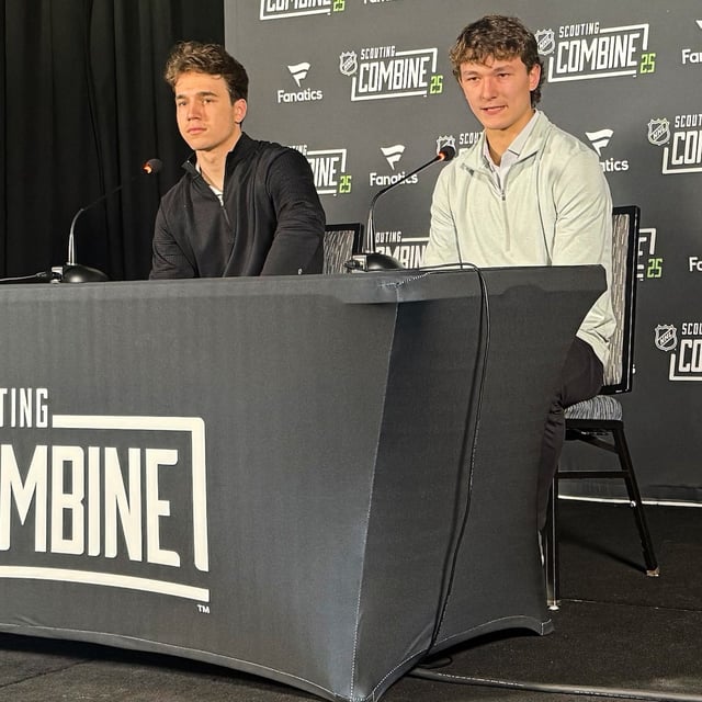 Defenseman Matthew Schaefer, right, and forward Michael Misa, NHL Central Scouting's top-two North American draft prospects, share the podium to address reporters at the league's annual combine being held at Buffalo's downtown Harborcenter facility, Friday, June 6, 2025. (AP Photo/John Wawrow)